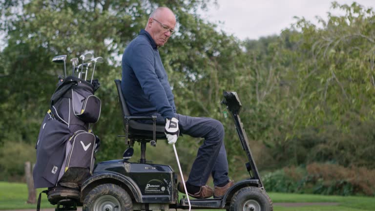 Senior person with disability, golf and sport with woman coaching, help and putt on field for rehabilitation. Retirement, mobility scooter and games for wellness and recovery in countryside on green