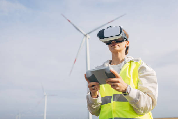 istock Woman using VR glasses to control windmills 1803859717