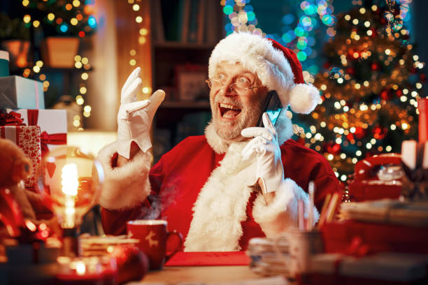 istock Happy Santa Claus having a phone call 1803860810