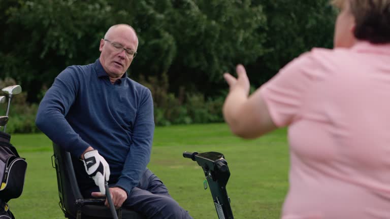 Senior man, woman and teaching for golf, sport and support with coaching, mobility scooter and club. Elderly person with disability, mentor or game for fitness, rehabilitation or exercise on green