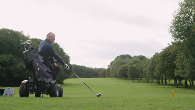 Mobility scooter, golf course and senior man swing for play game, training and sports recreation. Retirement, golfer and elderly person with disability and golfing ball for learning, hobby and stroke