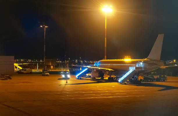 istock Passenger planes at night airport. 1803873350