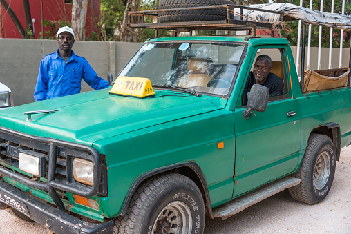 Serekunda, Gambia - May 11, 2017: All-terrain taxi near the hotel zone