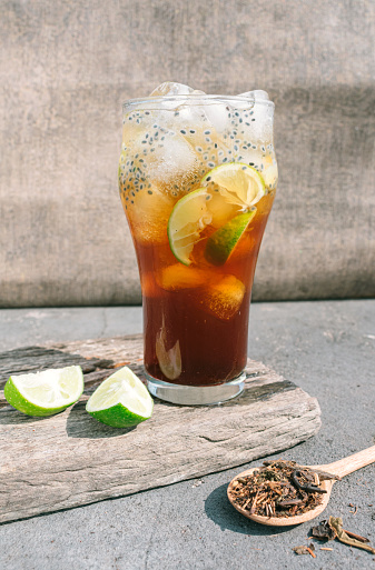 Iced tea with lime slices and chia seed