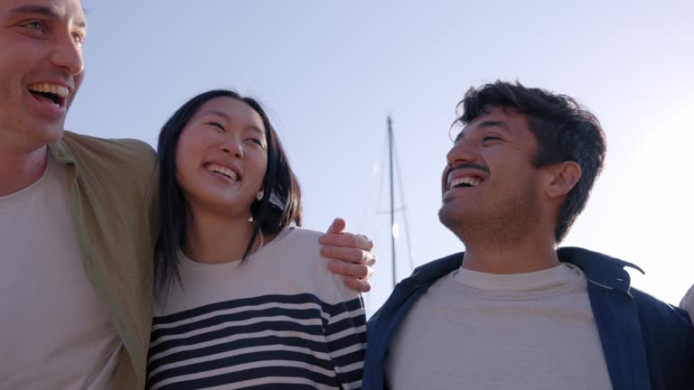 Multiracial group of friends outdoors smiling and having fun. International students happy together