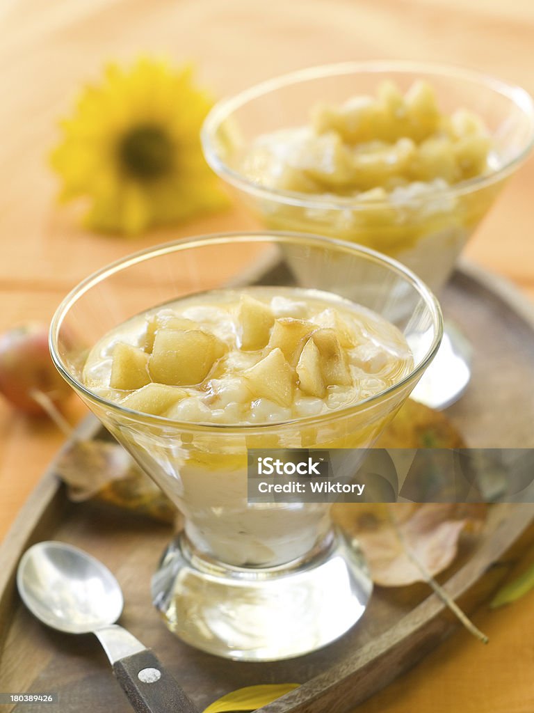 rice pudding Creamed rice pudding with apple sauce, selective focus Appetizer Stock Photo