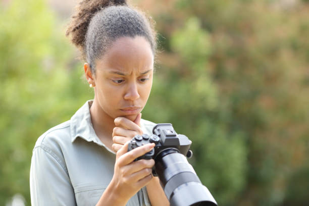 istock Worried black photographer checking bad results 1803901127