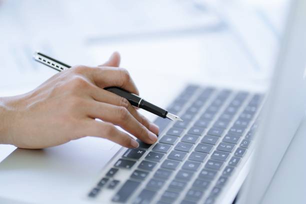 istock Business man working using laptop computer Hands typing keyboard. Professional investor working start up project. business planning in office. Technology business Concept 1803913204