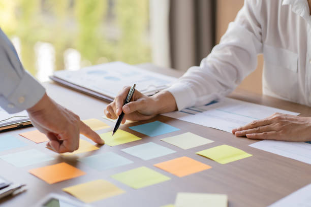 istock Business People brainstorming Meeting Design Ideas use post it notes to share idea professional investor start up project business brainstorming planning in office 1803913291