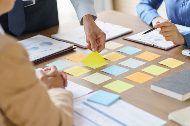 istock Business People brainstorming Meeting Design Ideas use post it notes to share idea professional investor start up project business brainstorming planning in office 1803925954