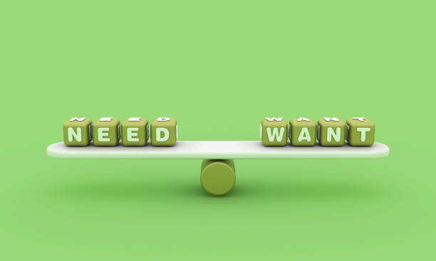 istock Seesaw with NEED WANT Buzzword Cubes 1803944364
