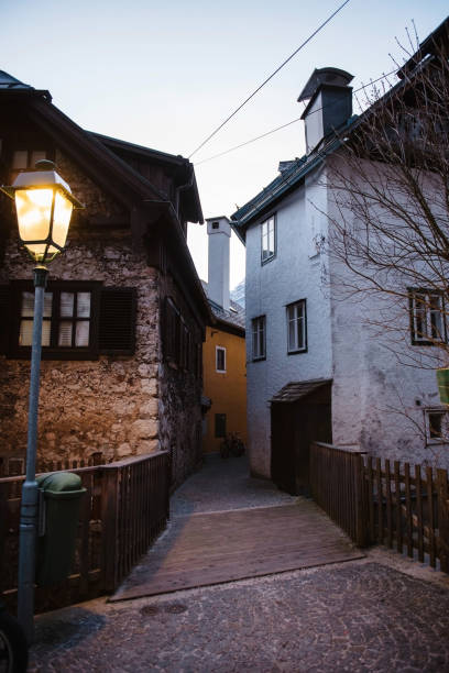 Street view with burning lantern and old stone buildings