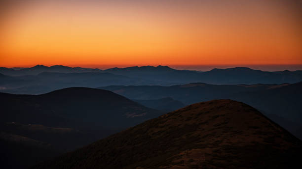 istock Mountain landscape with colorful sky during sunset 1803956438