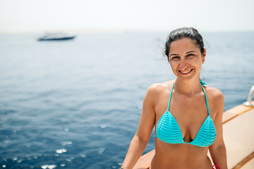 Portrait of a beautiful young woman on the boat in the Red sea in Hurghada in Egypt.