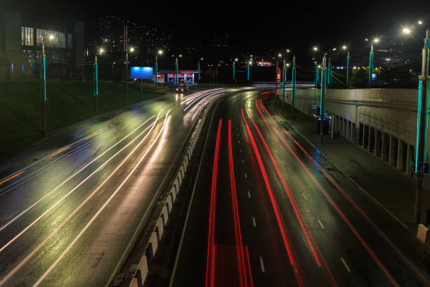 istock Car traffic at night, blurry motion 1803971550
