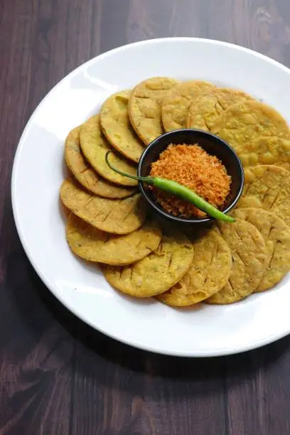 Photo of Crispy and crunchy methi mathri is a popular tea time snack in north India. It's especially popular during the Diwali festive season. It's a savory cracker or Masala puri. Copy Space.