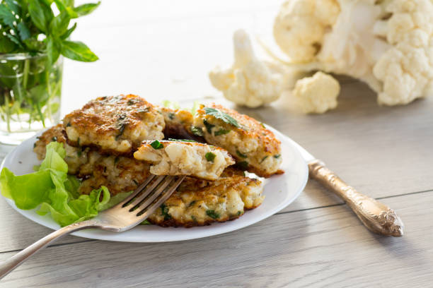 istock cooked vegetarian fried cauliflower cutlets, in a plate . 1803981012