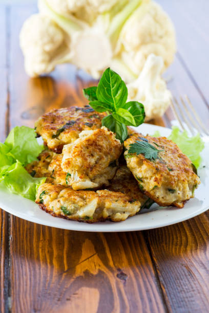 istock cooked vegetarian fried cauliflower cutlets, in a plate . 1803981554