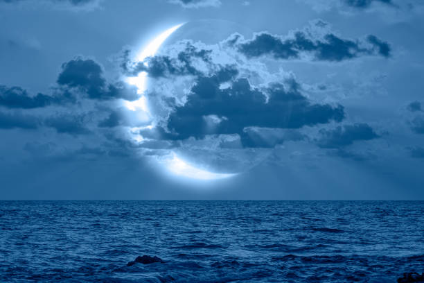 istock Night sky with crescent bright moon in the clouds 1803989838