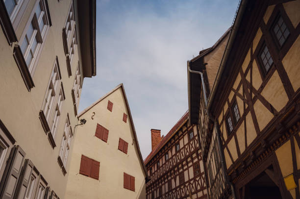 spring trip to Europe. Travel and German sightseeing locations. scenic view to facade of old historic houses somewhere in Erfurt city, Traditional half-timbered houses makes cozy and fairy tail mood