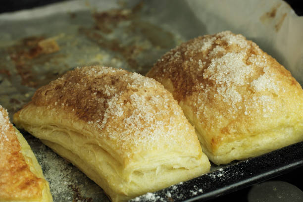 istock Folded baked puff pastry pies portions, top view 1804003580