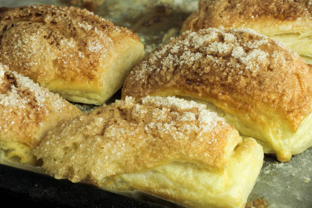 istock Folded baked puff pastry pies portions, top view 1804003586