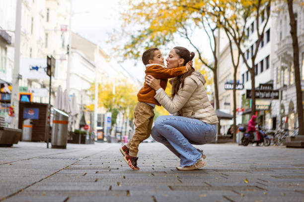 Mother and son cuddling in Vienna, Austria