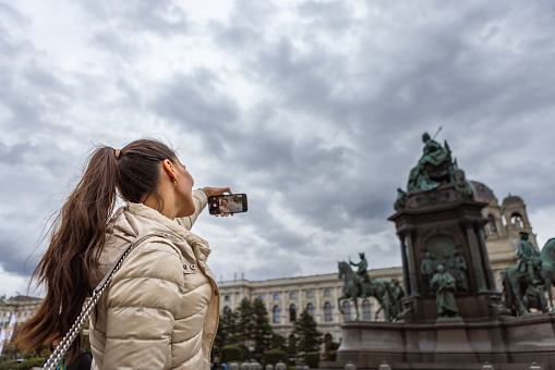 Woman, tourist taking a selfie in Vienna, Austria, Europe. Maria-Theresien-Platz