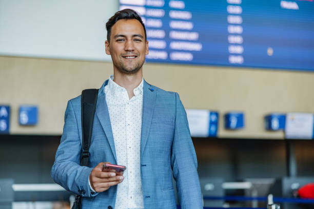 istock A Smiling Mixed-race Man Standing At The Airport Terminal 1804007095