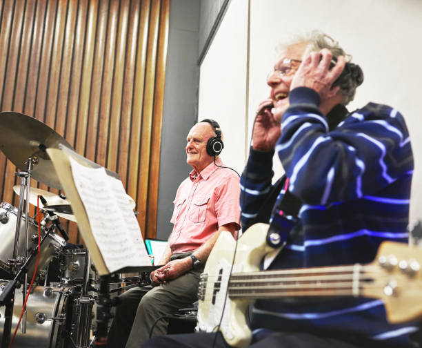 Men, band and recording studio or electric guitar for music audio album or rock song, entertainment or performance. Old person, group and string instrument or artist rhythm sound, hobby or creativity Men, band and recording studio or electric guitar for music
audio album or rock song, entertainment or performance. Old person, group and string instrument or artist rhythm sound, hobby or creativity old person listening to radio stock pictures, royalty-free photos & images
