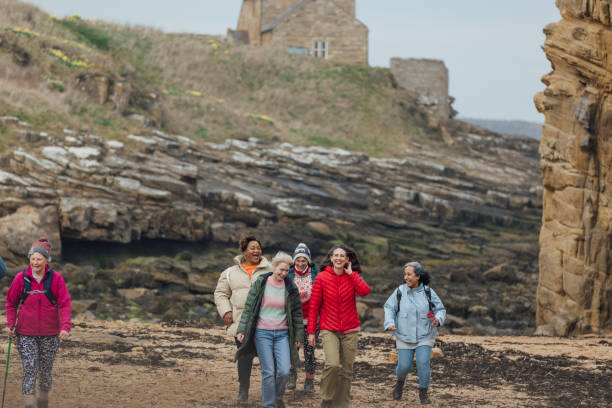 istock Beautiful Beach Walks With Friends 1804013558