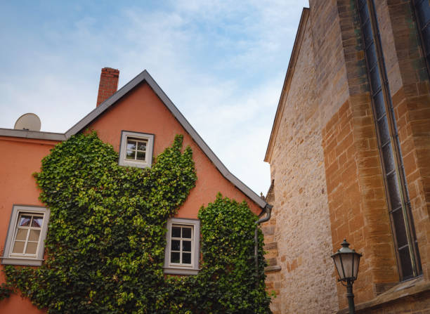 spring trip to Europe. Travel and German sightseeing locations. scenic view to facade of old historic houses somewhere in Erfurt city, details of ancient medieval houses, windows and doors