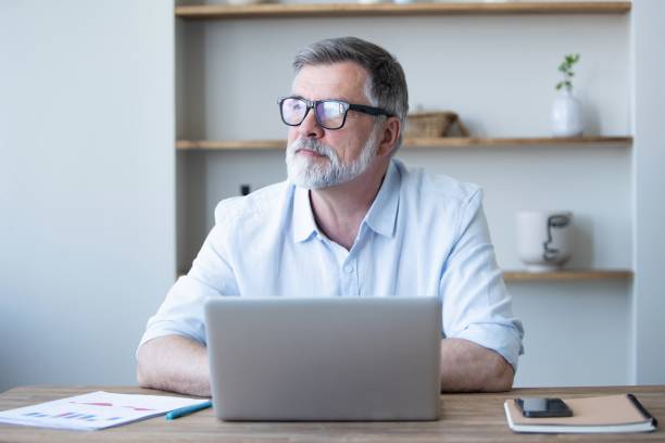 istock Mature businessman working from home using laptop 1804029353