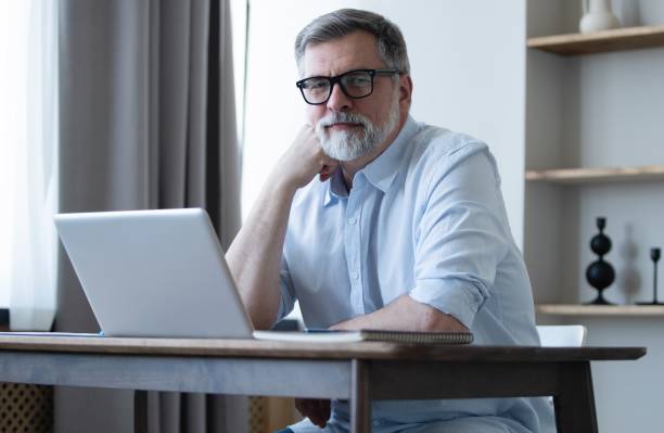 istock Mature businessman working from home using laptop 1804029697