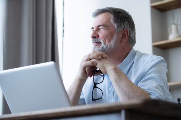 istock Mature businessman working from home using laptop 1804029699