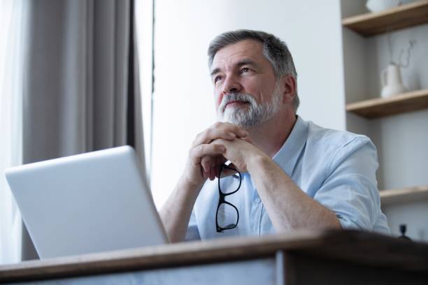 istock Mature businessman working from home using laptop 1804029704
