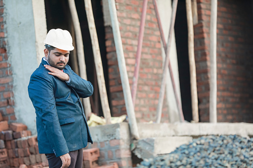 Portrait of civil engineer with safety uniform working at construction site outdoor, Construction worker checking and controlling project on building site, Architecture engineering on new project