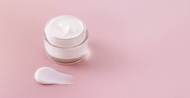istock cream jar cosmetic smear cream texture on pastel pink background 1804050075