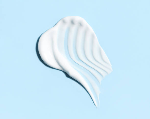 istock cosmetic smears cream texture on pastel blue background 1804050090