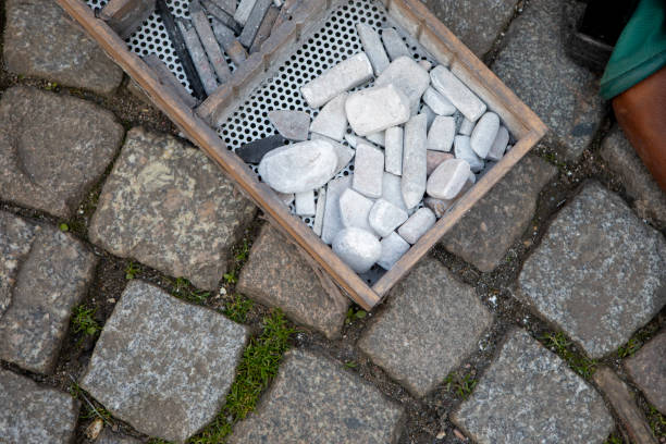 Artist's chalk in a box on a pavement