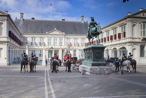 Amalienborg Palace in Copenhagen, Denmark. Surrounding the palace square with its statue of King Frederik V from 1771, Amalienborg is made up of four identical buildings.