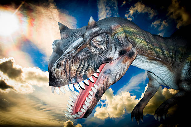 istock Scary Dino Tyrannosaurus Rex in a dark sky 180409797