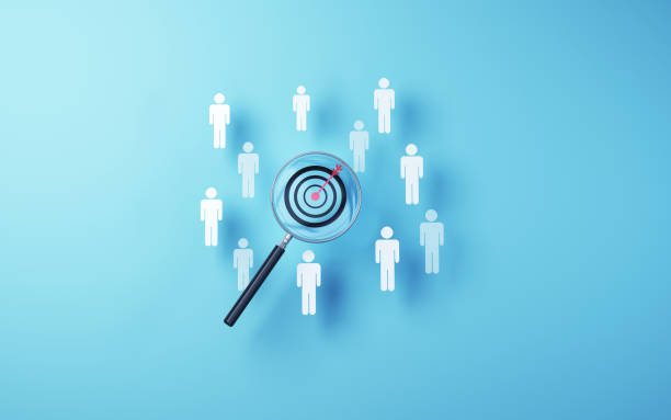 istock Target icon selected in metallic magnifying glass on soft blue background 1804102078