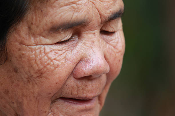 istock old woman closes one's eyes 180411205