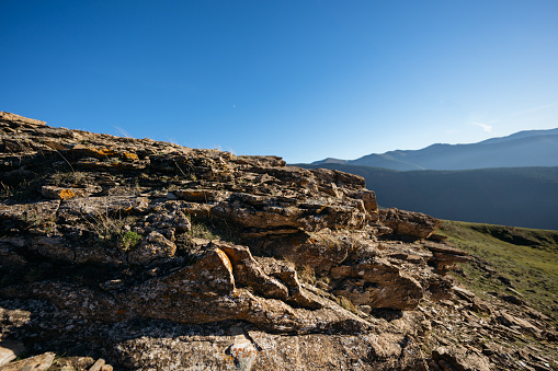 Scenery with rocks and clear blue sky. Space for text.