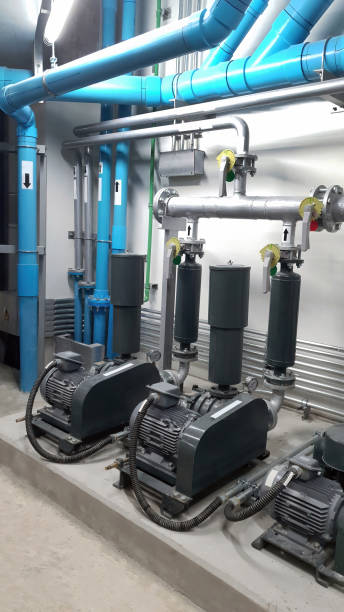 istock Set of equalization pump installed in the basement with vertical and horizontal pipeline flow for building engineering system, construction, plumbing 1804127278