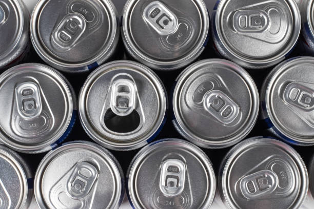 istock metal beer cans background, one can is open. top view 1804131705