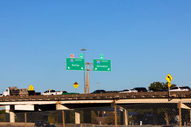 highway 45 with direction signage Dallas and Galveston under blue sky