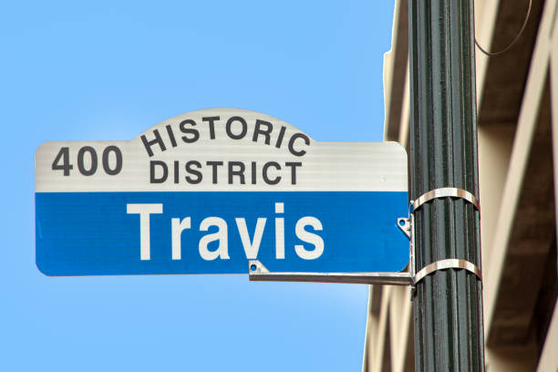 istock street sign travis in downtown Houston, Texas 1804162567