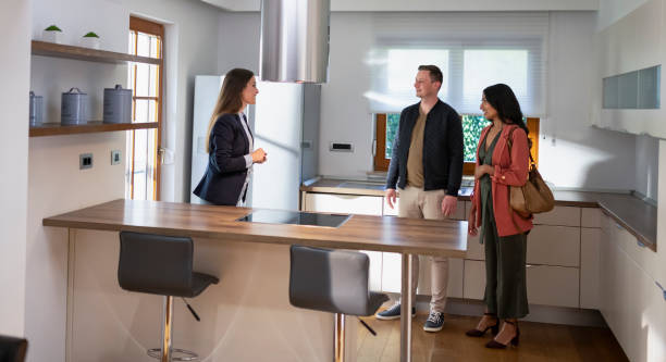 istock Estate Agent Talking With Potential Buyers 1804171885